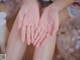 A woman is washing her hands with soap. 